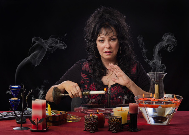 Stunning witch predicts by wax reading - Photo, Image