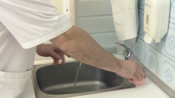 Doctor wash their hands with soap ridiculous. Soap in the form of tooth-jaw - Filmati, video