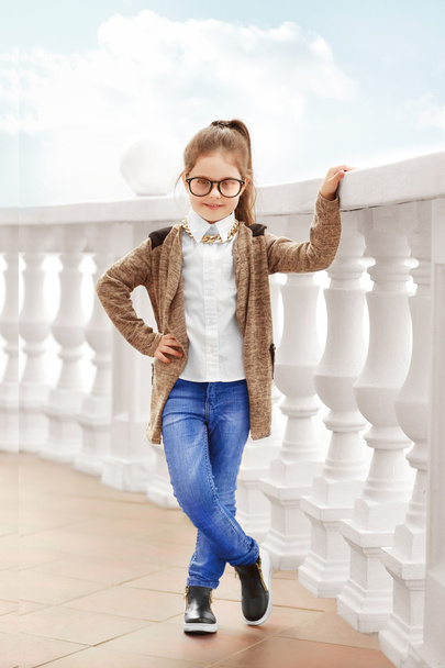 Little girl wearing stylish clothes outdoors. - Photo, image