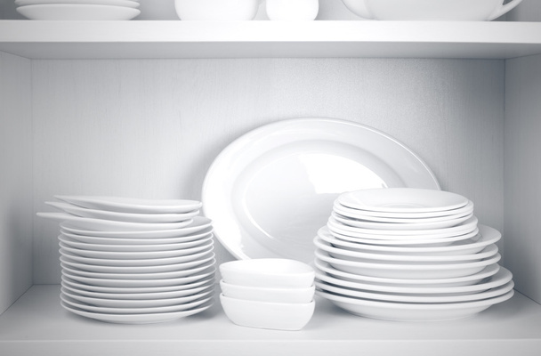 Dishes in cupboard in the kitchen - 写真・画像