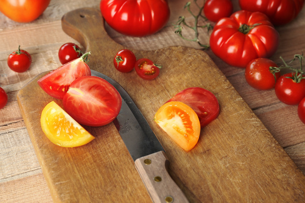 Composition of tomatoes and slices  - Φωτογραφία, εικόνα
