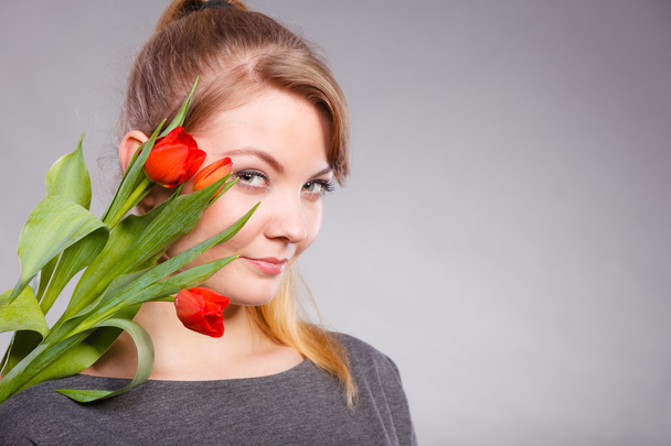 Girl with red tulips - Zdjęcie, obraz
