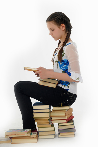 Cute young female with a stack of books - Foto, Bild