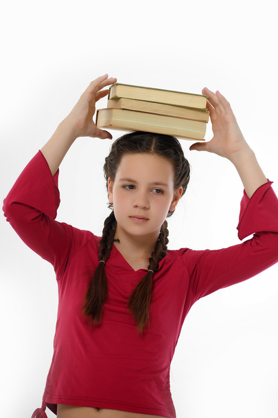 Girl with Her Books on Her Head - Zdjęcie, obraz
