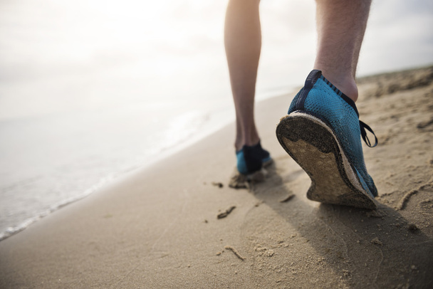 Feet on sandy beach  - Foto, afbeelding