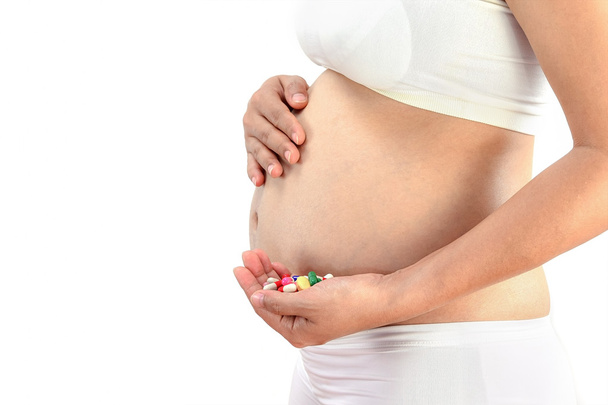 Pregnant woman with medicine pill,pregnancy health - Foto, imagen