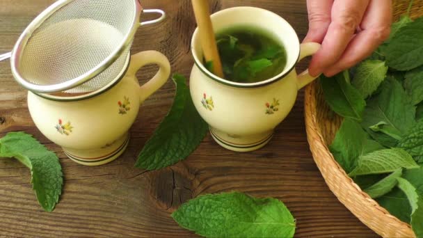 Healthy herb tea prepare. Fresh made Mint Tea - Footage, Video