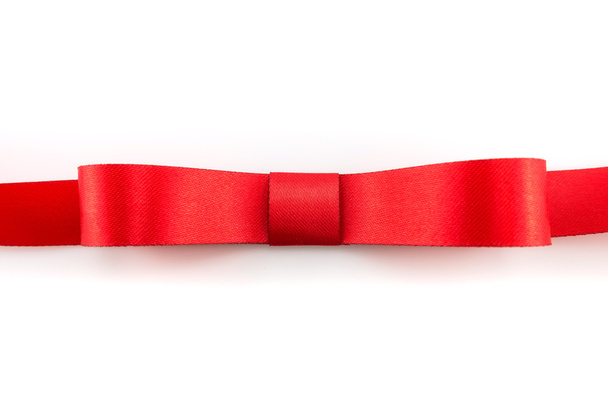 Shiny red ribbon with soft shadow on white background - Фото, изображение