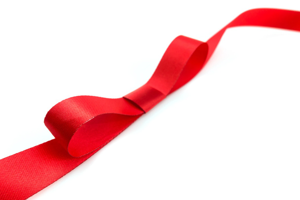 Shiny red ribbon with soft shadow on white background - Zdjęcie, obraz