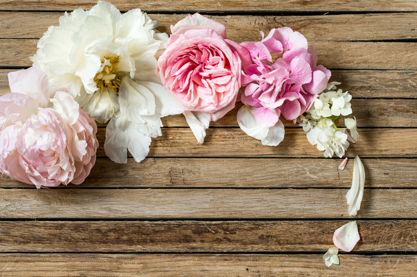 beautiful flowers on wooden background, various , place for text, closeup - Photo, Image