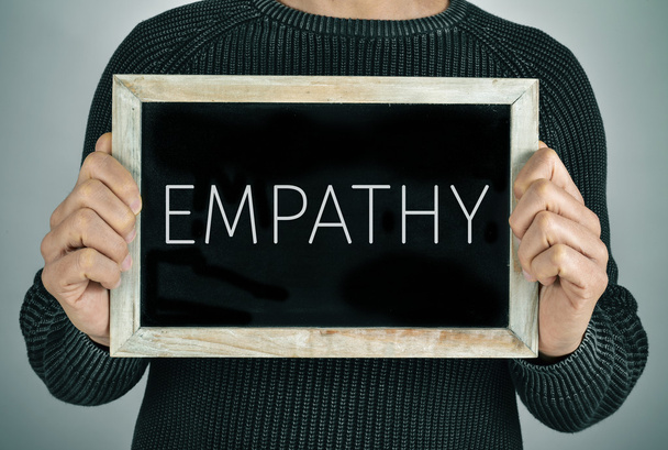 człowiek z tablica tekst empatii - Zdjęcie, obraz