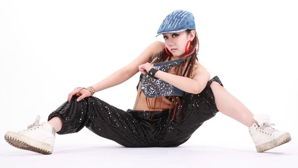 Cute girl in various dance costumes and fun poses. - Фото, изображение