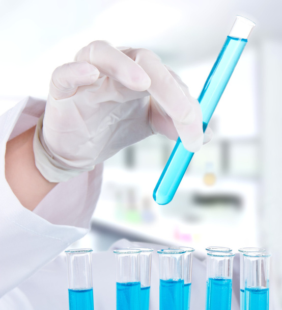 Female researcher with test tubes in laboratory - Zdjęcie, obraz