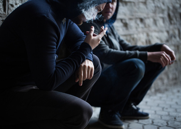 close up of young men smoking cigarettes - Photo, Image