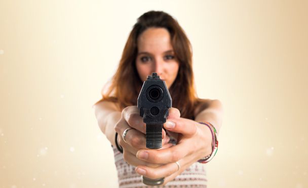 Girl holding a pistol - Photo, Image