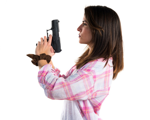 Fille tenant un pistolet
 - Photo, image