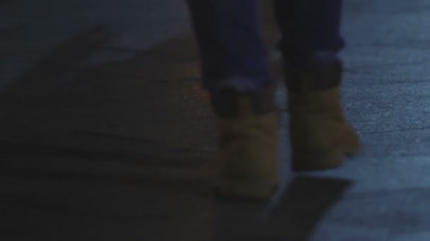 Lonely female walking in beautiful night city, feet closeup. Melancholy - 映像、動画
