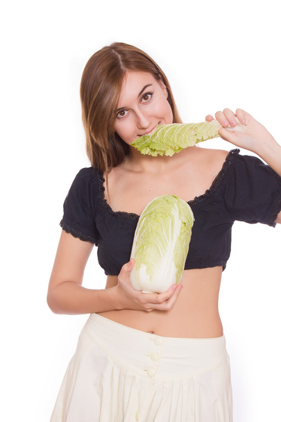 woman holding a Chinese cabbage in her hand - Foto, imagen