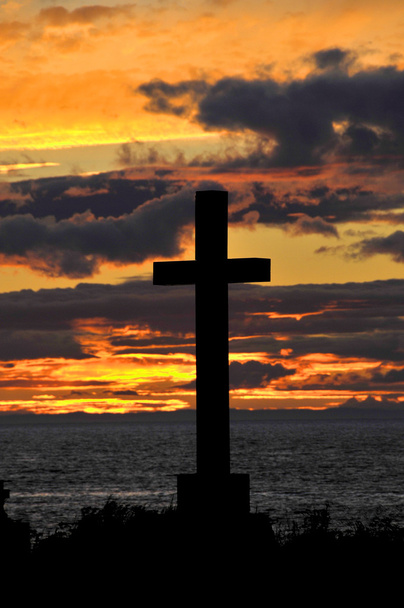 Cross sign on sea coast at sunset - Photo, Image