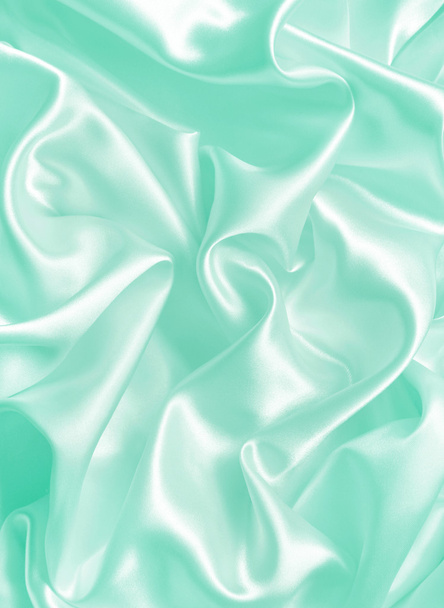Smooth elegant green silk or satin texture as background - Фото, изображение