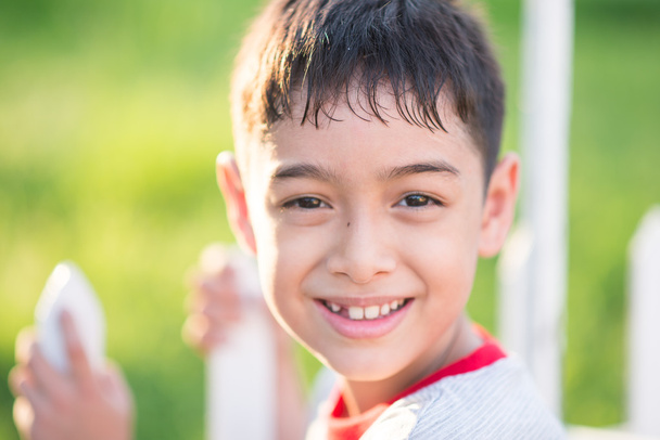 Close up happy face of boy outdoor in the sunset time - Fotoğraf, Görsel