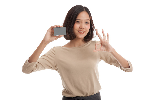 Young Asian business woman show OK with a blank card - Fotoğraf, Görsel