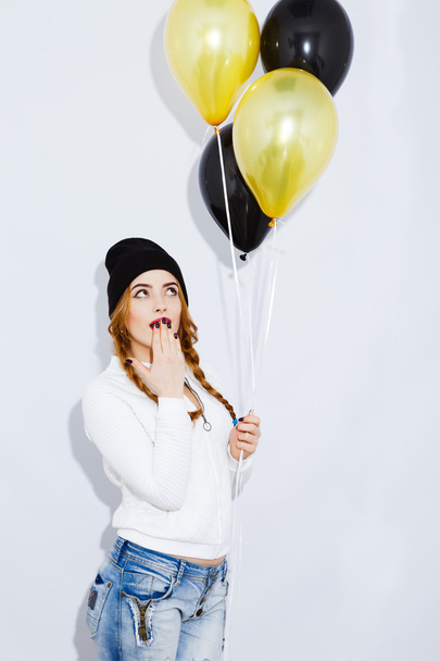 Stylish girl with balloons on white background - Photo, Image