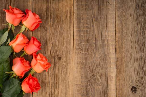 rose on wooden background - Фото, изображение