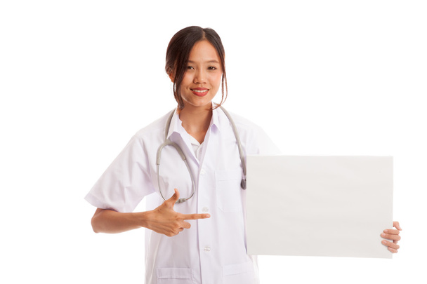 Young Asian female doctor point to a blank sign - Foto, Imagen