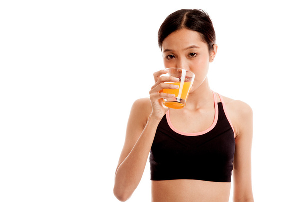 Beautiful Asian healthy girl drinking  orange juice - Φωτογραφία, εικόνα