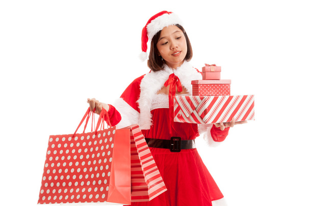 Asian Christmas Santa Claus girl with shopping bags and gift - Φωτογραφία, εικόνα