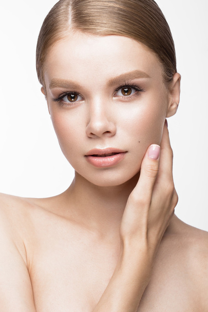 Beautiful young girl with a light natural make-up and French manicure. Beauty face. - Valokuva, kuva