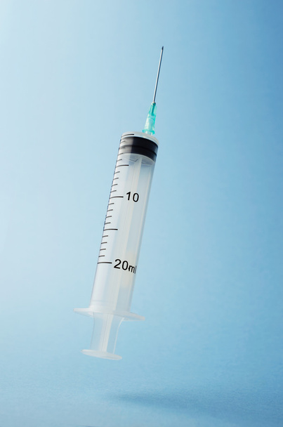 Syringe floating in the air - Photo, Image