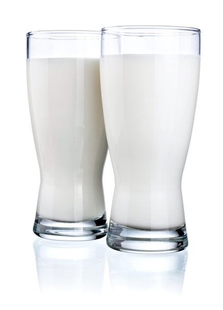 Two Glasses of fresh milk isolated on a white background - Fotó, kép