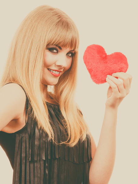 Woman gorgeous girl holding red heart love symbol  - Фото, изображение