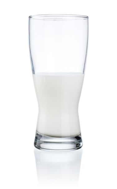 Half a glass of fresh milk isolated on a white background - Fotoğraf, Görsel