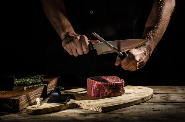 Chef butcher prepare beef steak - Fotoğraf, Görsel