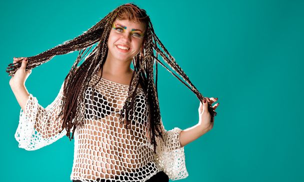 Smiling woman with braids - Foto, imagen