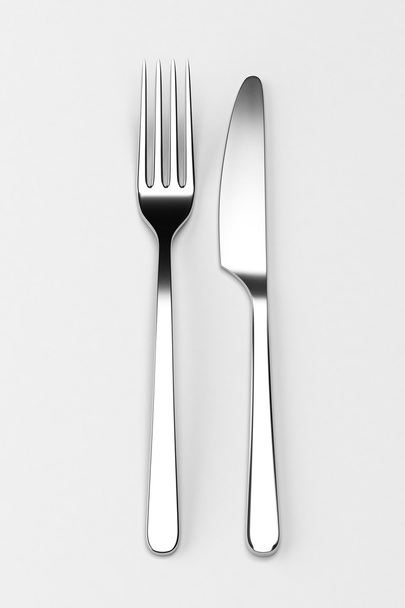 Fork and knife on grey - Foto, afbeelding