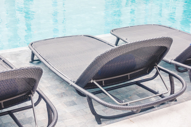 Chair around swimming pool - Фото, изображение