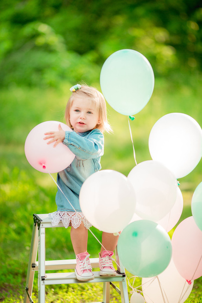 Little happy girl with balloons - Фото, зображення