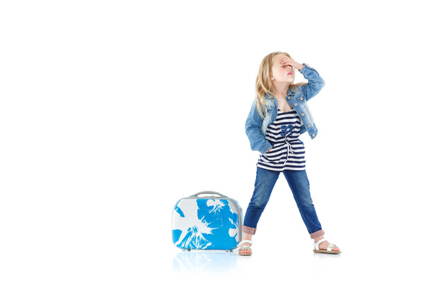 child with blue suitcase - Фото, зображення