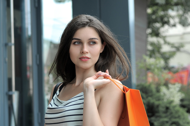 Portrait of a girl with shopping bags. - Foto, Imagen