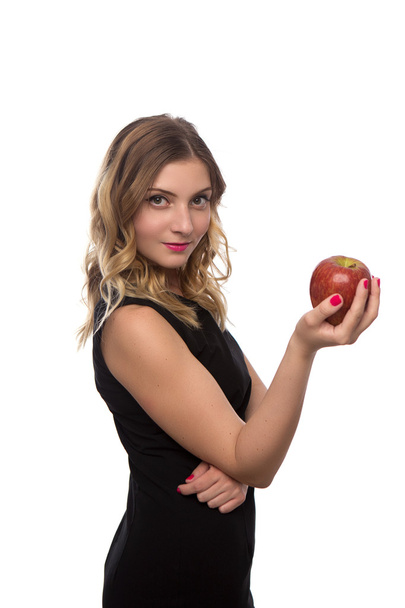 young beautiful girl in black dress with Apple in hands isolated on white background - Φωτογραφία, εικόνα