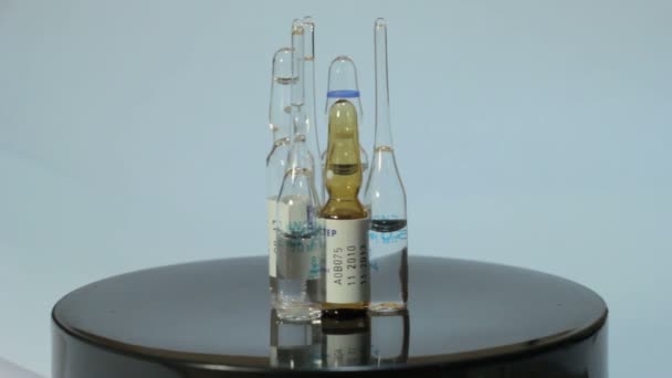Ampoules rotate  on a white background 1 - Footage, Video