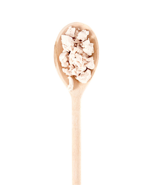 Fresh yeast on wooden spoon - Foto, immagini