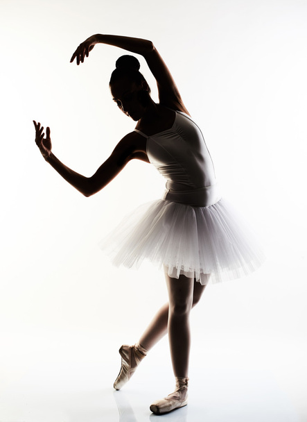 Ballerina performing a dance against a white background - Foto, imagen