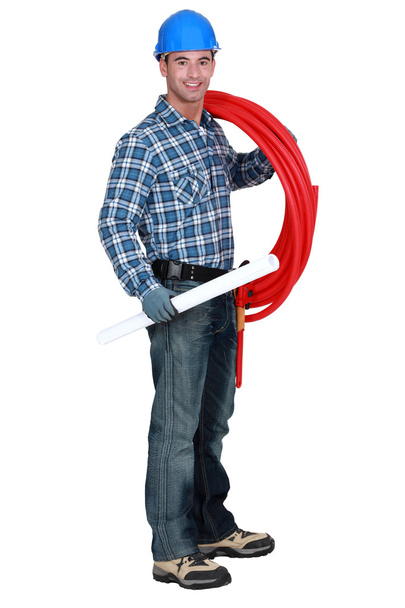 Portrait of handsome plumber carrying red hose isolated on white - Foto, Imagem