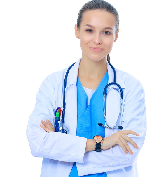 Woman doctor with stethoscope standing with arms crossed isolated on a white background - Фото, зображення