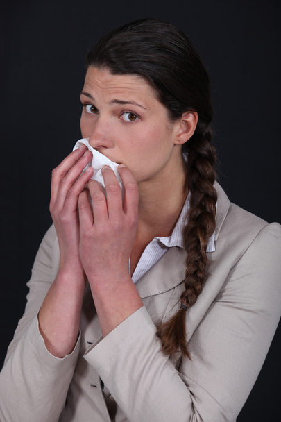 Woman wiping mouth with tissue - Zdjęcie, obraz